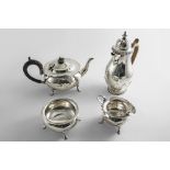 AN EARLY 20TH CENTURY THREE-PIECE CIRCULAR TEA SET on four feet, with wavy rims, crested, by C.