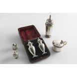 A MIXED LOT:- An Art Deco sugar caster, a cased pair of pepperetes, a small egg-shaped pepperette, a