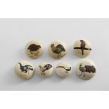 SHIBAYAMA BUTTONS Seven Japanese ivory buttons inlaid with different birds; five 3 cms, two 2.25