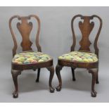 PAIR OF GEORGE I WALNUT DINING CHAIRS, the vase shaped splat with flowerhead carving above a
