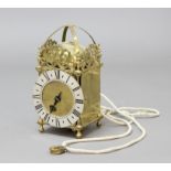 HOOK AND SPIKE BRASS LANTERN CLOCK, with a 6 1/2" silvered chapter ring, on a 30 hour, single hand