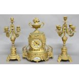 FRENCH GILT BRASS AND PORCELAIN CLOCK GARNITURE, the dial with blue enamelled numerals on a brass