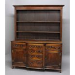 WELSH OAK BREAKFRONT DRESSER, 19th century, the three shelf plate rack on a base with an arrangement