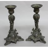 PAIR OF BRONZE CANDLESTICKS, of rococo, scrolling form, height 24cm (2)