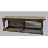 OAK REFECTORY TABLE, late 17th or early 18th century, the cleated top above a carved frieze with