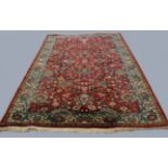ORIENTAL CARPET, possibly Indian, circa 1960, the blood red field with an allover design of