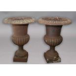PAIR OF CAST IRON GARDEN URNS, with egg and dart rim, gadrooned body and square foot, height 75cm (