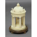 GRAND TOUR INTEREST: A circular ivory temple, the domed roof with a temple finial and urns above six