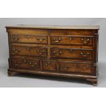 OAK AND WALNUT CROSSBANDED DOWRY CHEST, 18th century, the hinged top opening to reveal a vacant