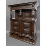 COURT CUPBOARD, perhaps 17th century, the cornice supported by three figural pilasters before a pair