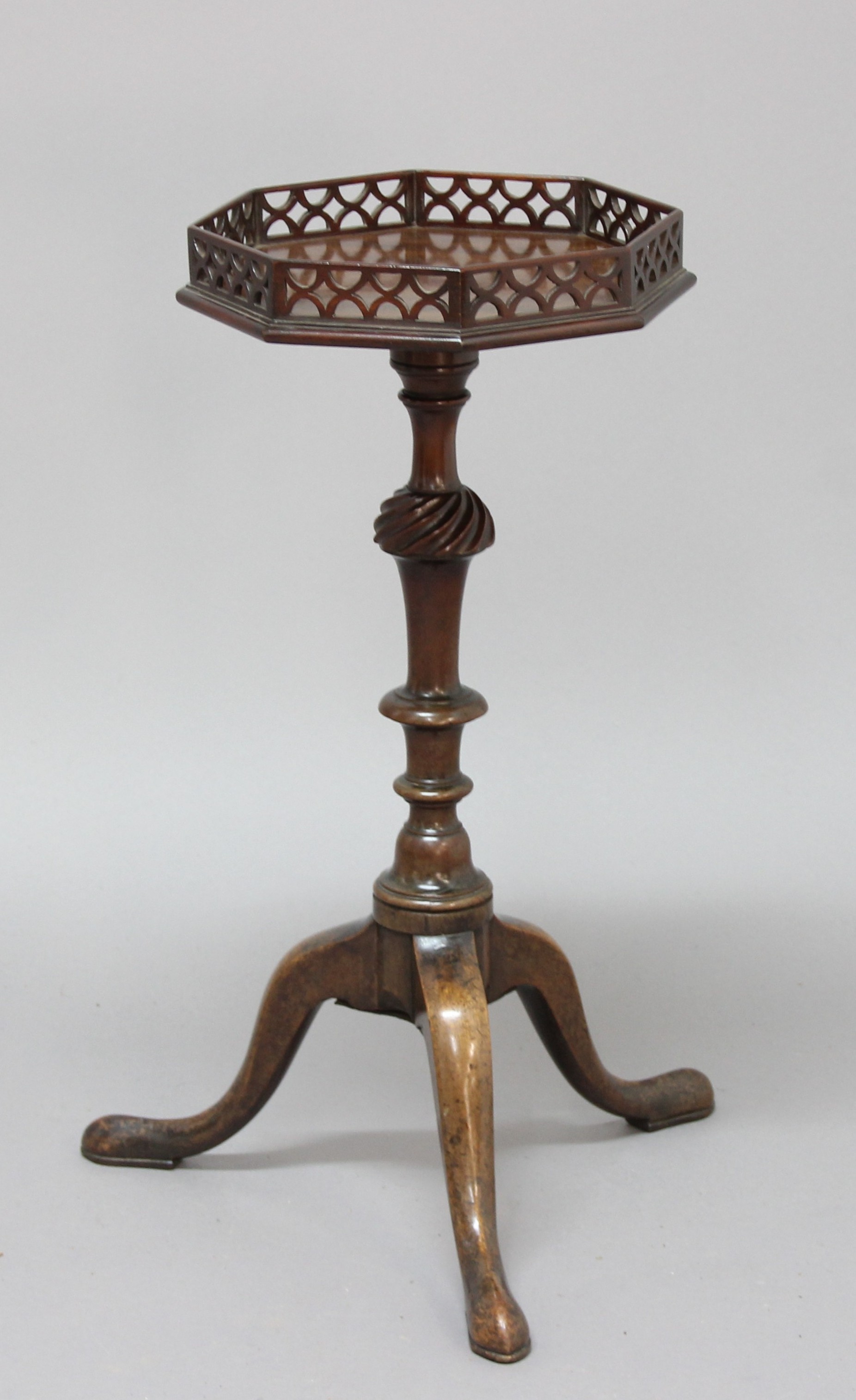 GEORGE III MAHOGANY WINE TABLE, the galleried, octagonal top on a turned and wrythen carved column