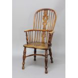 ASH AND ELM WINDSOR CHAIR, 19th century, the high back with fir tree splat, baluster arm supports