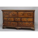 OAK DOWRY CHEST, 18th century, the hinged top opening to reveal a vacant interior fronted by two