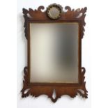 GEORGE III MAHOGANY FRET CARVED WALL MIRROR, the bevelled rectangular plate with parcel gilt