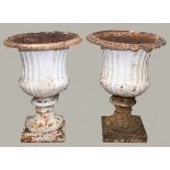 PAIR OF LARGE CAST IRON GARDEN URNS, the fluted body with scrolled rim, socle base and square