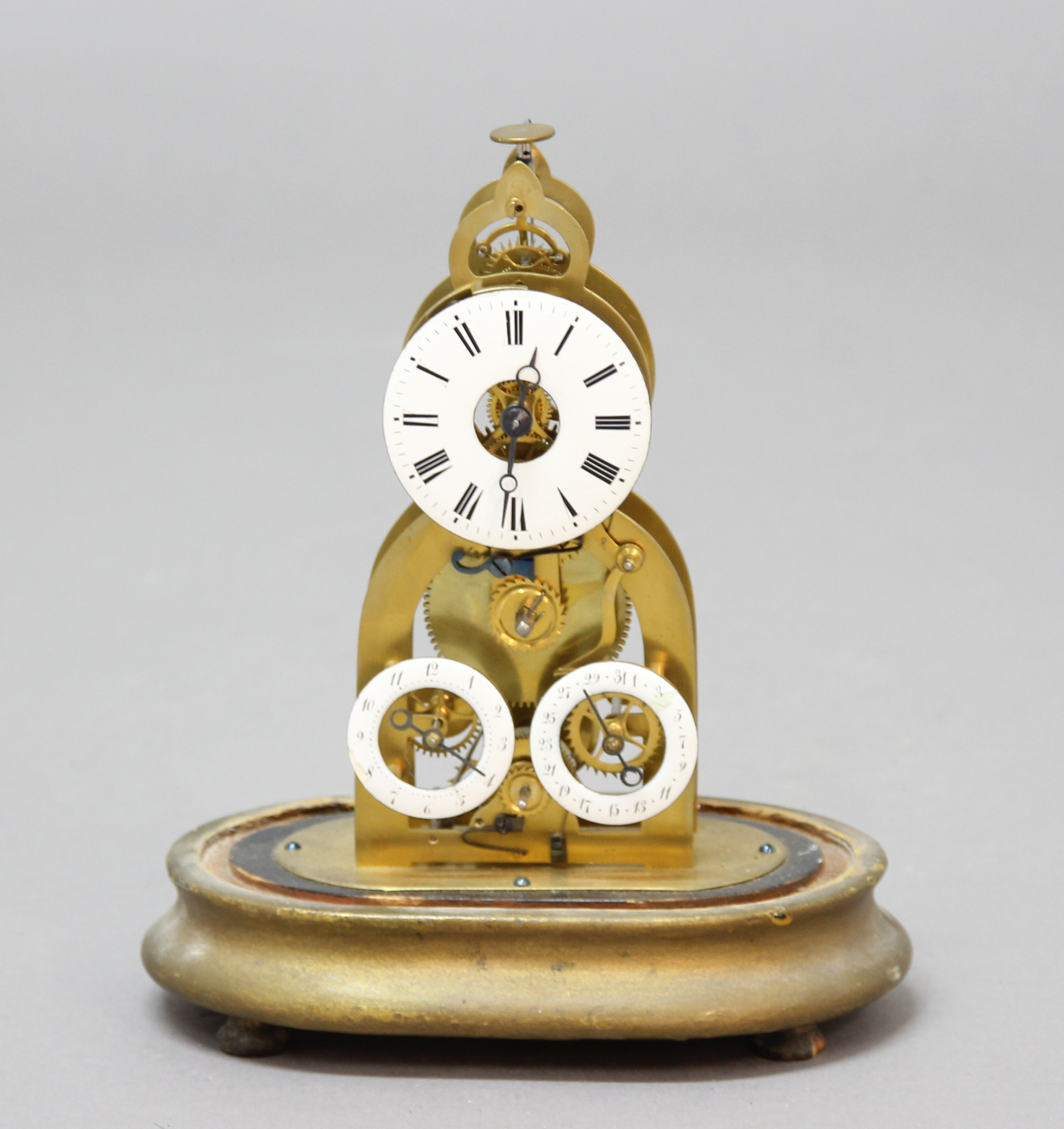 FRENCH BRASS SKELETON TIMEPIECE, the 2 1/2" enamelled dial above subsidiary alarm and date dials - Image 2 of 2