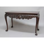 GEORGE II STYLE IRISH MAHOGANY SERVING TABLE, the rectangular top above a frieze centred on a