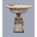 RECONSTITUTED STONE URN, with old paint, on a pedestal, height 110cm