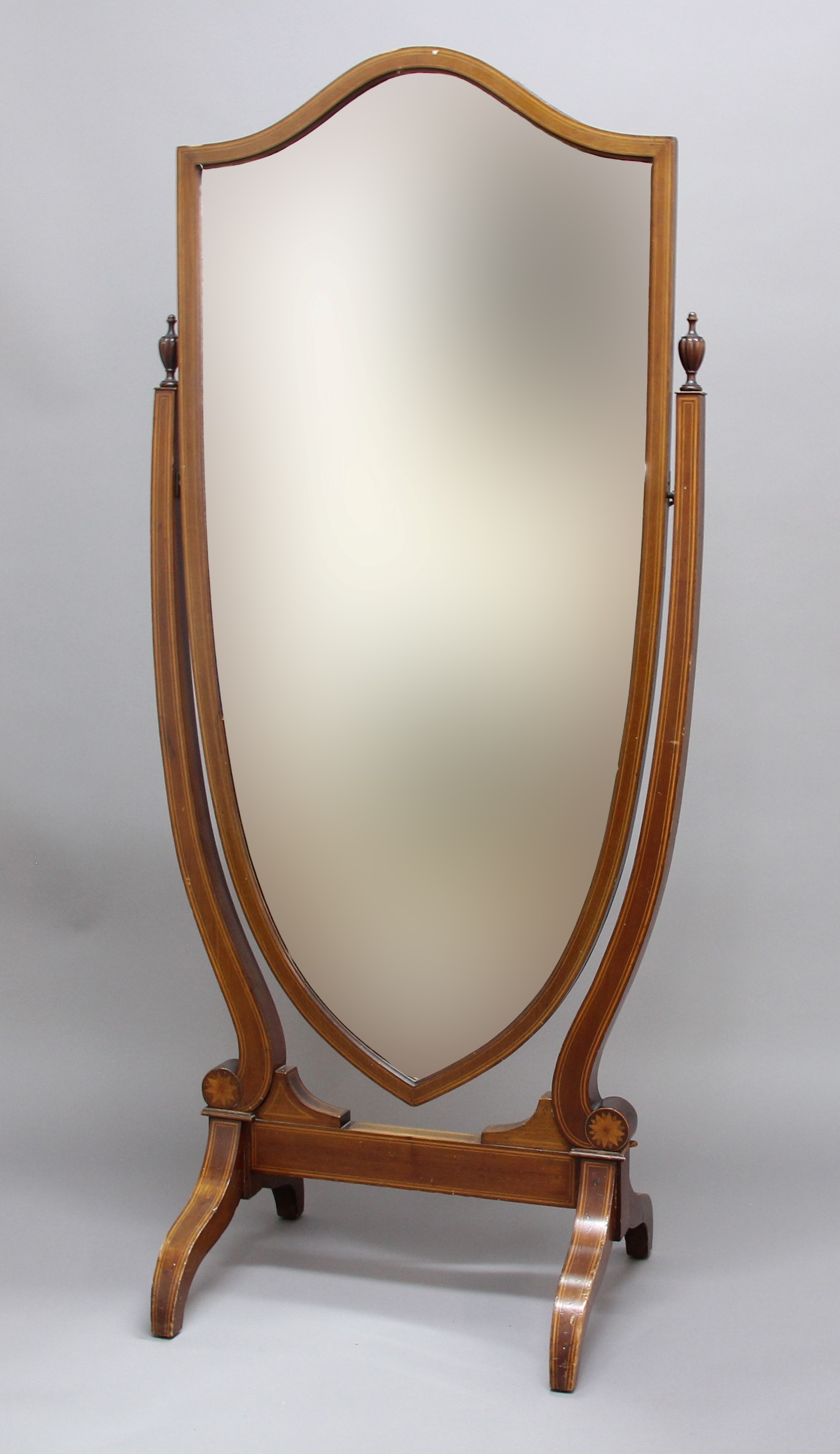 SHERATON REVIVAL MAHOGANY CHEVAL MIRROR, the bevelled shield shaped plate on an inlaid frame with