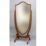SHERATON REVIVAL MAHOGANY CHEVAL MIRROR, the bevelled shield shaped plate on an inlaid frame with