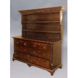 GEORGE III OAK DRESSER, with dentil cornice and two shelf rack on a base with two runs of three