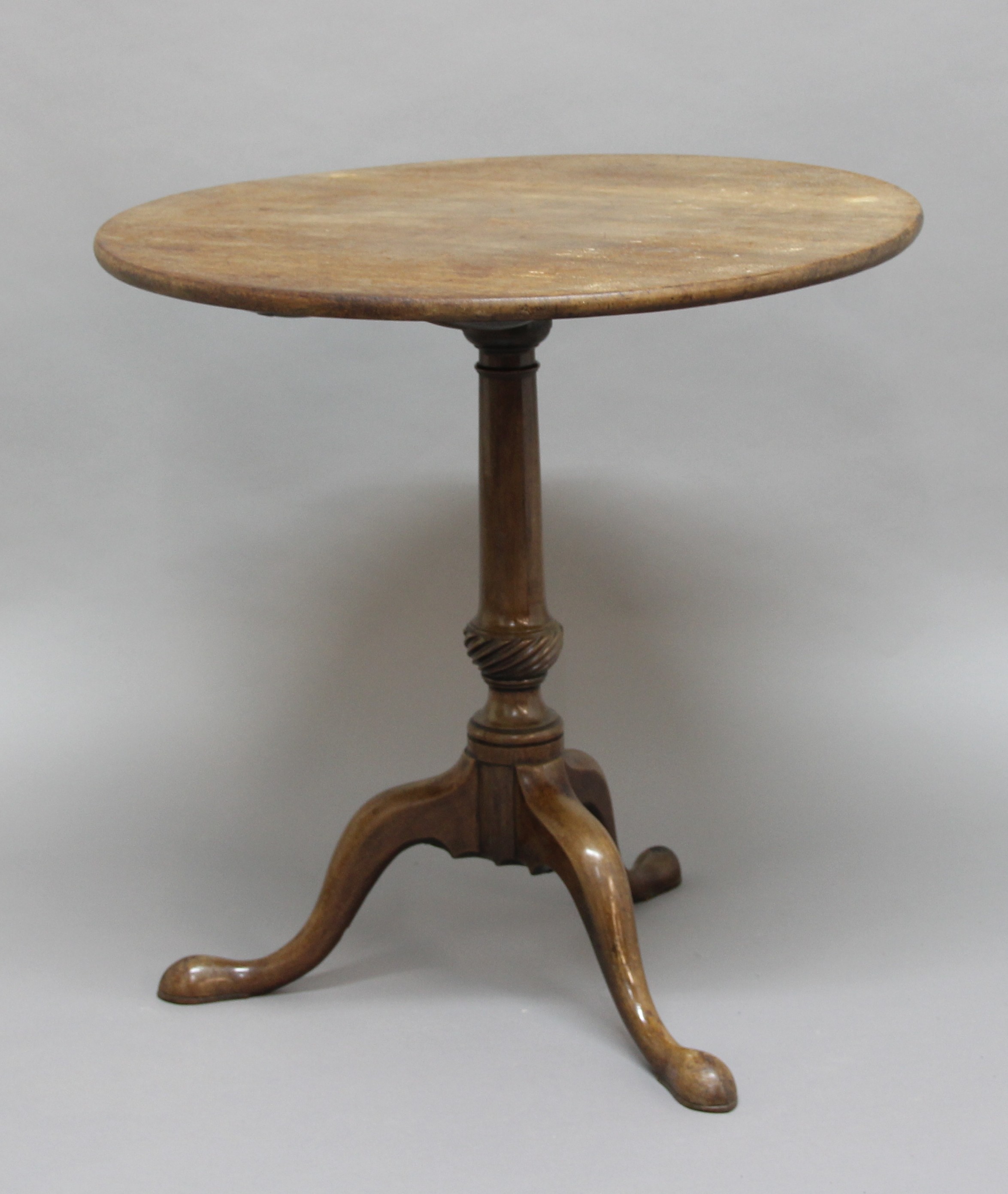 CIRCULAR MAHOGANY TILT-TOP TABLE, 19th century, on turned column and three outswept legs, height