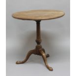 CIRCULAR MAHOGANY TILT-TOP TABLE, 19th century, on turned column and three outswept legs, height