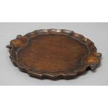 GEORGE III MAHOGANY TRAY, with pie crust rim and two scrolling handles, width 31cm