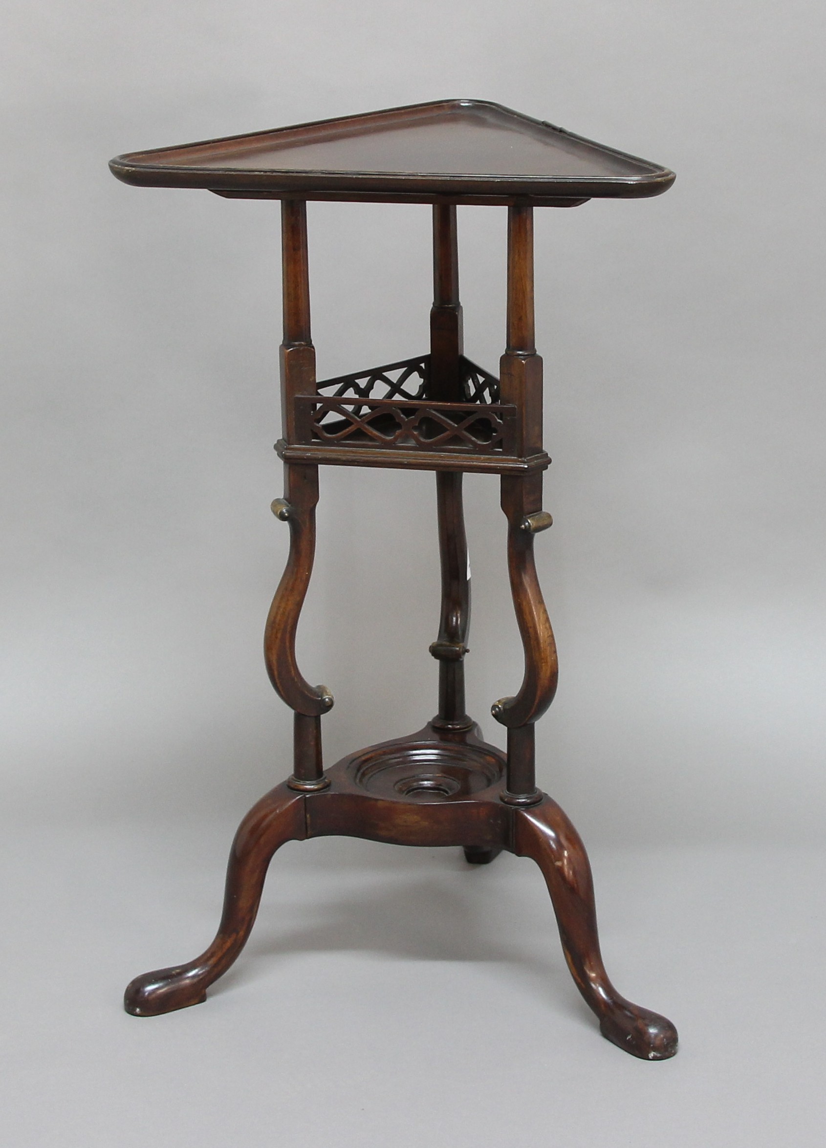 19TH CENTURY MAHOGANY LAMP TABLE, the triangular top above pierced gallery and scrolling supports,