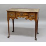 18TH CENTURY OAK LOWBOY, with three drawers above a fret carved frieze, height 70cm