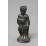 BRONZE FIGURE EMBLEMATIC OF AUTUMN, perhaps 17th century, the classical child standing before a