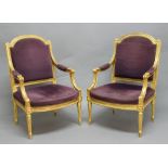 PAIR OF LOUIS XVI STYLE GILTWOOD OPEN ARMCHAIRS, 19th century, the arched foliate upholstered