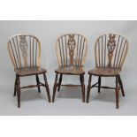 SET OF FOUR ASH AND ELM WINDSOR CHAIRS, 19th century, with fleurs de lys splats, solid seats and H