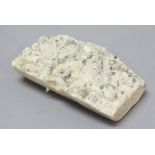 CARVED SANDSTONE SURMOUNT, carved with stylised foliage, height 14cm, width 22cm