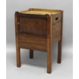 GEORGE III MAHOGANY TRAY TOP COMMODE, with sliding tambour front above a converted pot cupboard,