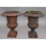 PAIR OF CAST IRON GARDEN URNS, with egg and dart rim, gadrooned body and square foot, height 62cm (
