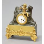 FRENCH MINIATURE TIMEPIECE, the circular, enamelled dial inside a gilt frame mounted in a bronzed
