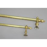 TWO BRASS CURTAIN POLES, one with orb finials, the other with octagonal finials, lengths 165cm and