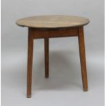 OAK CRICKET TABLE, 19th century, the circular top on tapering legs, height 71cm, width 73cm
