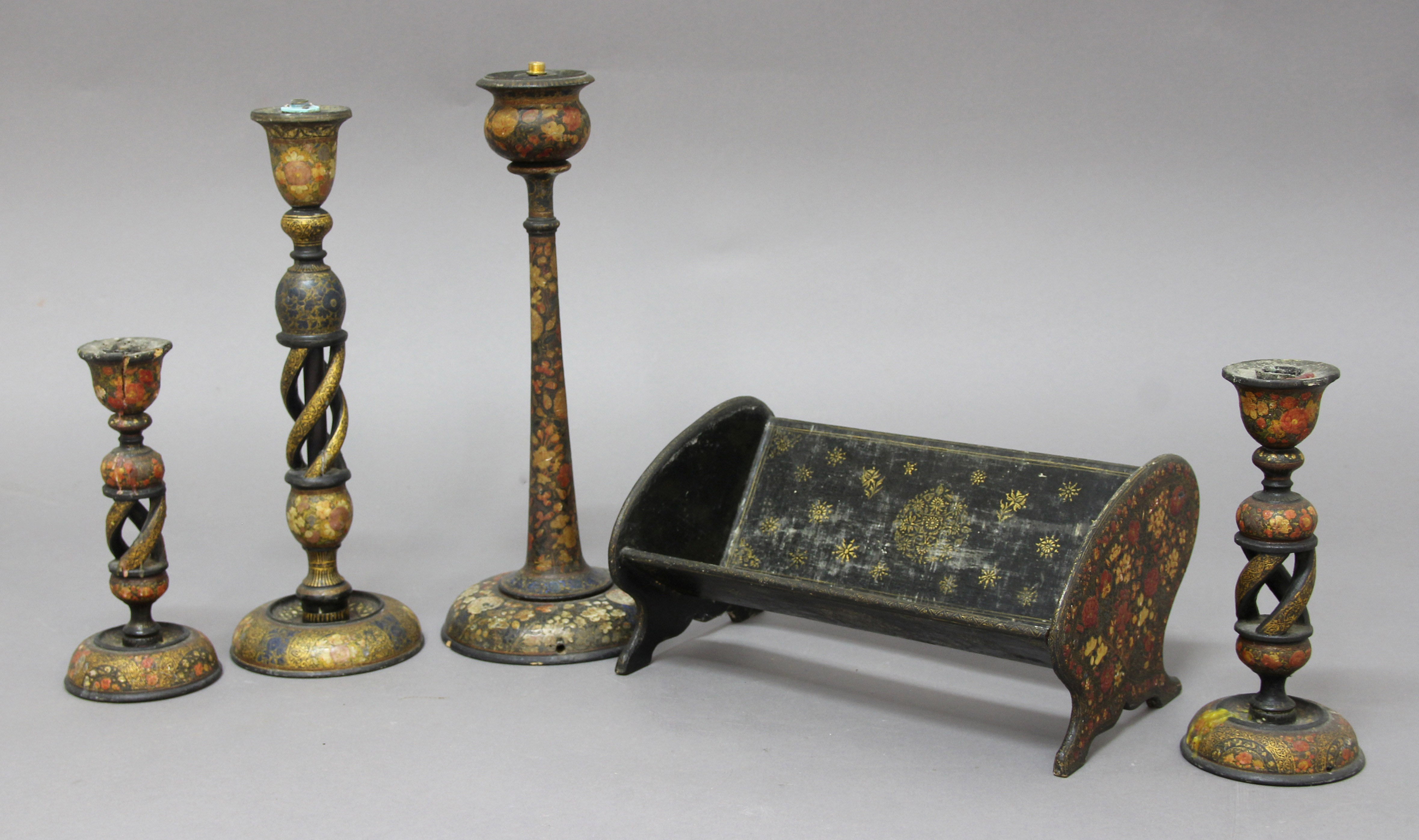 COLLECTION OF FOUR INDIAN LACQUERED CANDLESTICKS, 19th century, Kashmiri, with painted and gilt