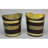 PAIR OF GEORGE III MAHOGANY AND BRASS BOUND PEAT BUCKETS, of coopered, tapering oval form with brass