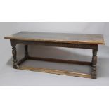 OAK REFECTORY TABLE, incorporating early wood, the three plank top above an arch carved frieze,