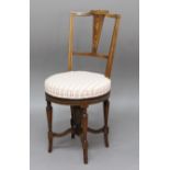 VICTORIAN ROSEWOOD AND INLAID REVOLVING MUSIC CHAIR, the inlaid back above a circular seat, tapering