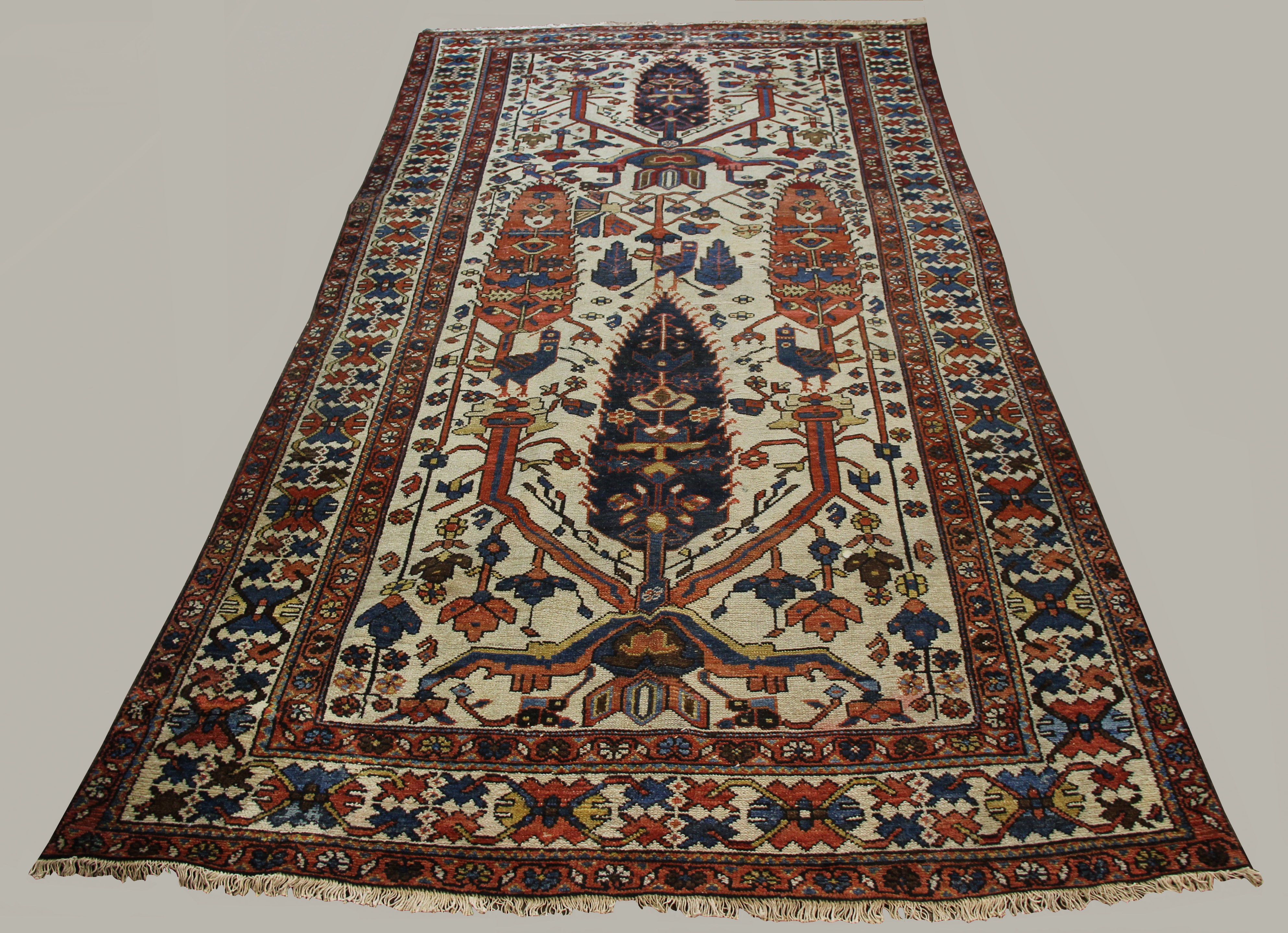 BAKHTIYARI RUG, West Iran, circa 1910, the ivory field with a one way design of stylised trees,