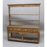 OAK DRESSER, late 17th/early 18th century, the two shelf plate rack on a base with two drawers and