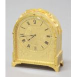 GILT BRASS TIMEPIECE, in the manner of Thomas Cole, the 3 1/2" dial with scrolling an foliate