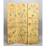 PAINTED LEATHER THREE FOLD SCREEN, early 20th century, decorated with flowering plants and