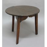 OAK CRICKET TABLE, 18th century, the circular top above a carved frieze on tapering legs, height