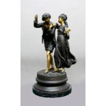 MANNER OF MOREAU, Rustic couple, she holding a mask, patinated and polished bronze, signature to the
