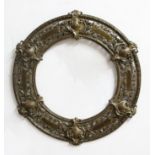 BRONZE CIRCULAR FRAME, with pierced foliate decoration and shield crests, diameter 58cm